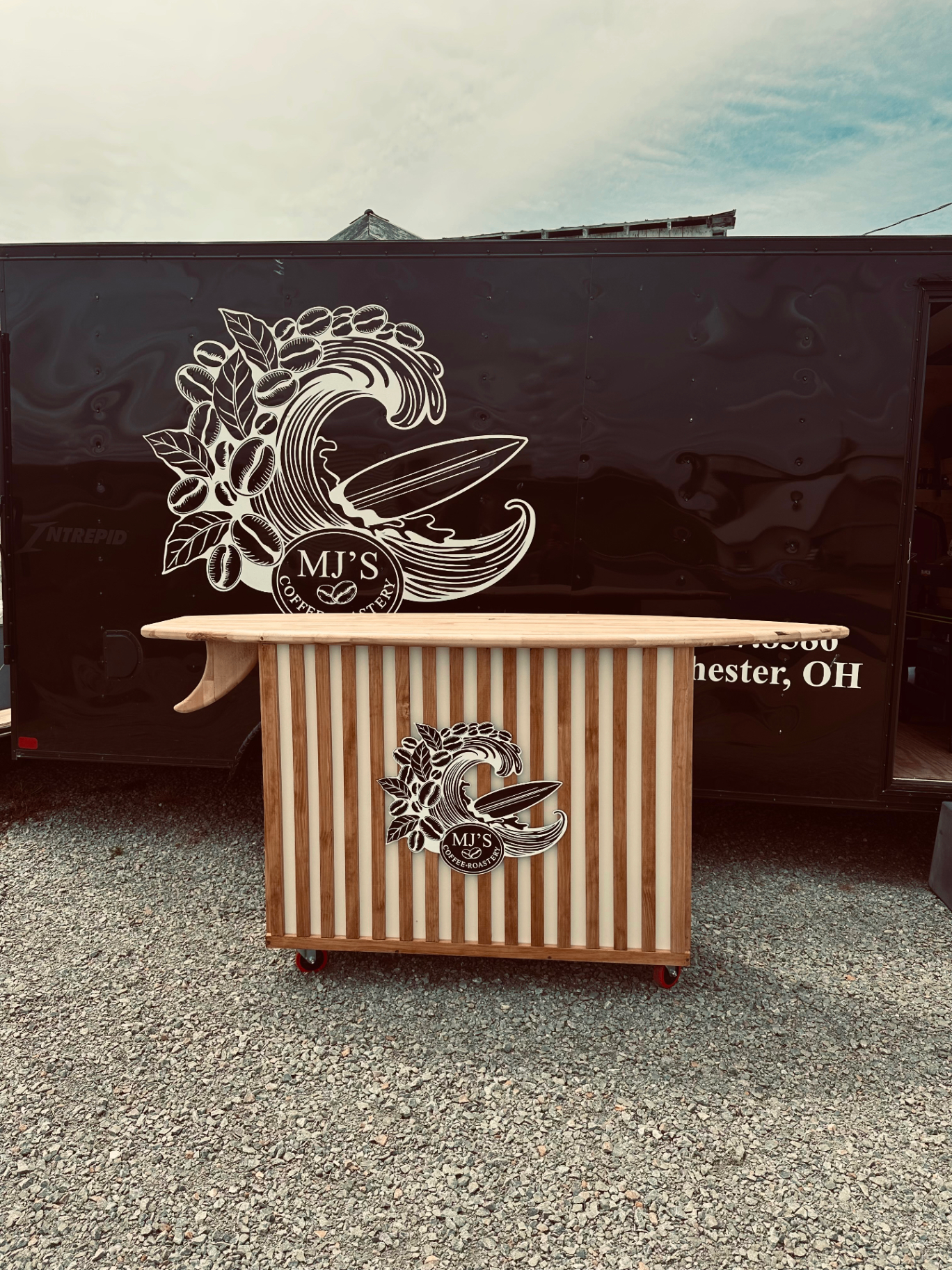 MJ's Coffee Roastery mobile trailer with custom surfboard bar